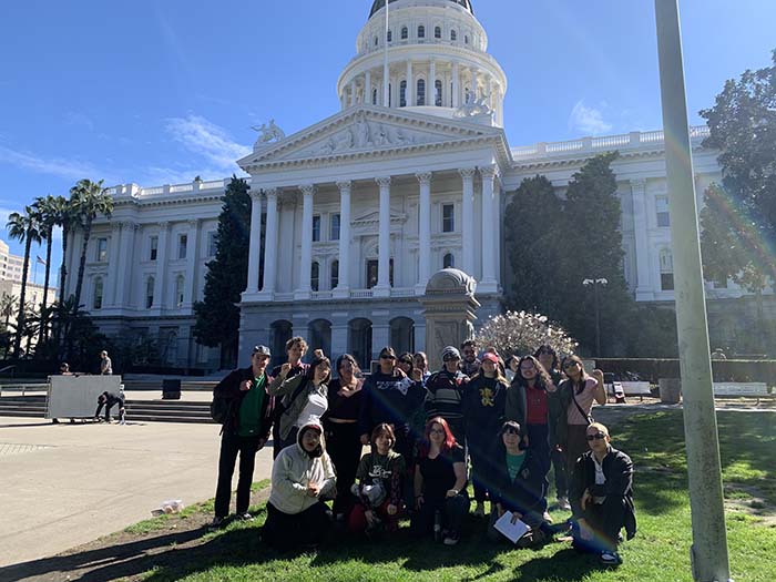 image of students in front of the "building name here"